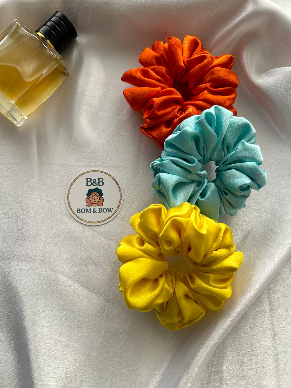 Orange aqua yellow scrunchies